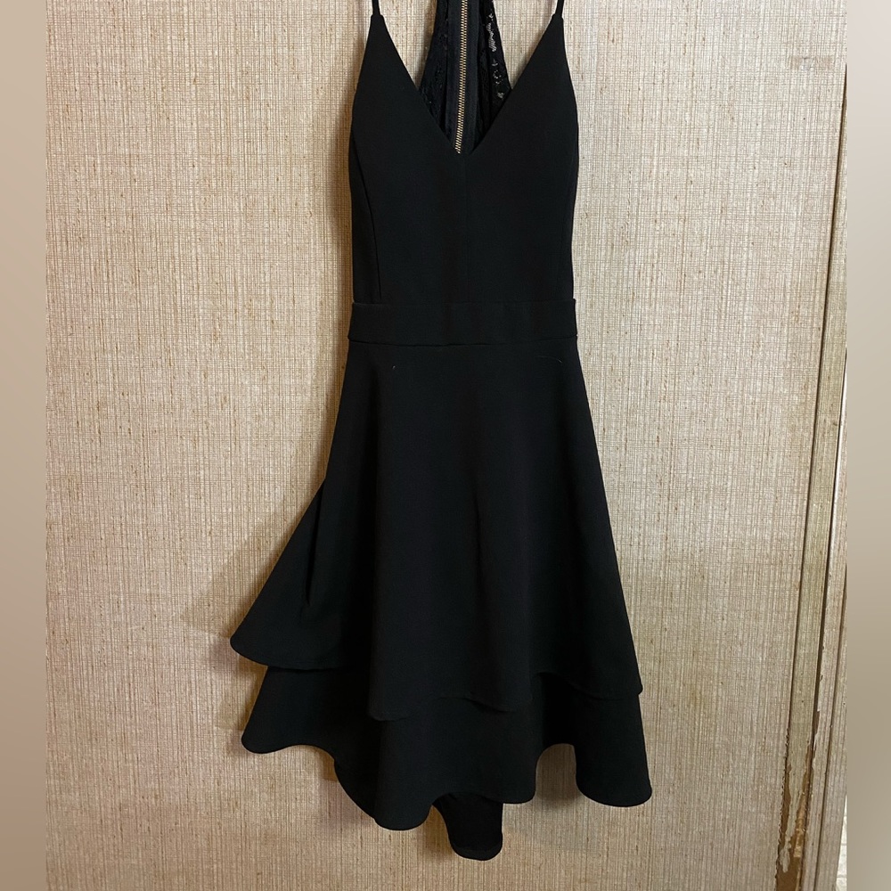 Cute little women’s black dress with a Lacey back